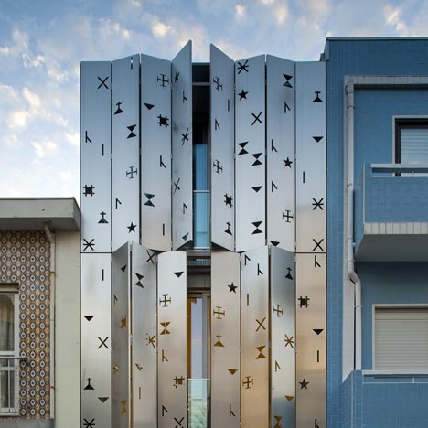 House 77 by dIONISO LAB. #façade comprising #aluminium shutters perforated with symbols. #architecture #Portugal goo.gl/Q4sjs
