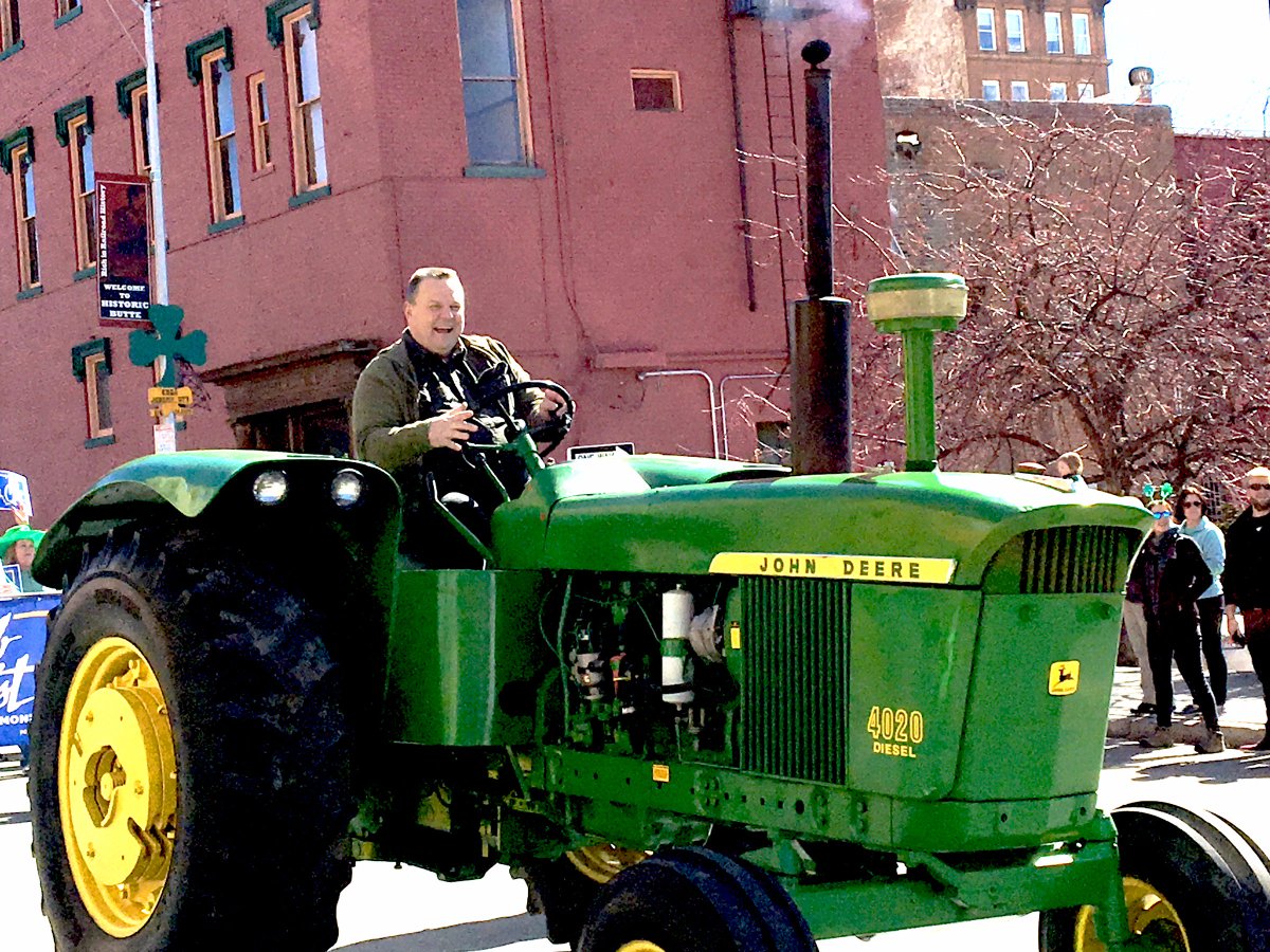 AnniePentilla's tweet photo. Sen. Jon Tester opted for a tractor for the #StPatricksDay Parade in Butte #buttepats #butteirish @jontester @mtstandard https://t.co/IoRNYxanOY