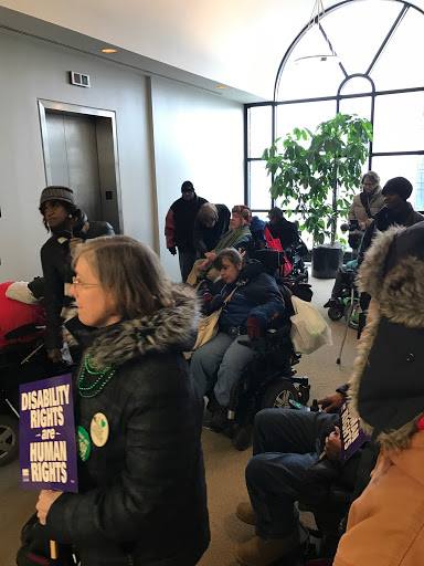 NationalADAPT's tweet photo. .@ADAPTChicago has arrived at @PeterRoskam's office. #SaveMedicaid #NoACHA https://t.co/ODFWHVFNNj