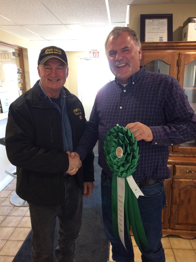 OttawaFarmShow's tweet photo. Congratulations & thanks to Derek Crosby of D & J Transport - green ribbon partner #ovfs17 -presenter @HaroldMcphail https://t.co/cetjPtDy3N
