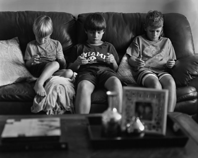 jasuja's tweet photo. A photographer edits out our smartphones to show our strange and lonely new world https://t.co/3b6VjVV329 #DigitalOverkill https://t.co/Ls0Hh3SgOa