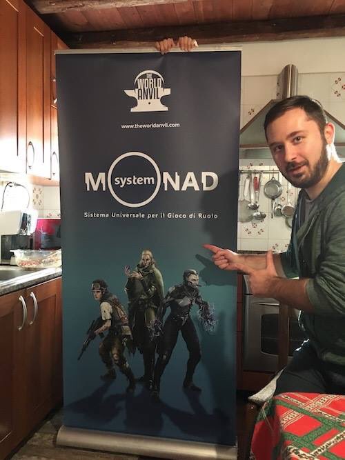 TheWorldAnvil's tweet photo. Procedono i preparativi per #PLAYModena. Su sfondo rustico, Tommaso presenta il roll up del #MONADSystem @PLAYmodena https://t.co/jmGipBfnoP