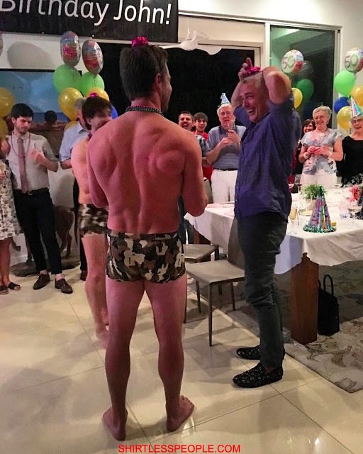 Stephen Amell shirtless in fatigue speedo wishing John Barrowman happy birthday 