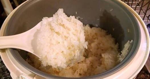 unplugging the rice cooker for somebody's breakfast tomorrow. yes you heard that right: unplugging.