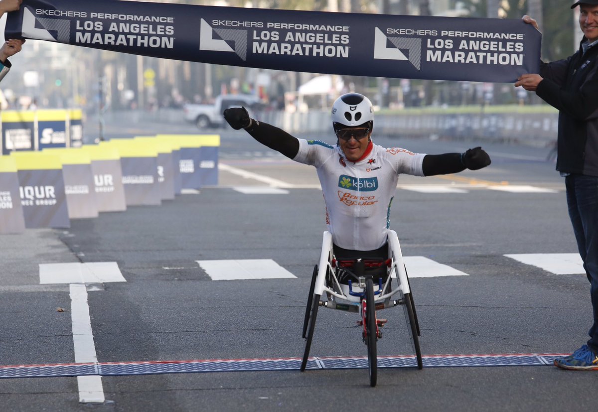 latimes's tweet photo. Wheelchair winner Laurens Molina crosses the finishing line at the 32nd annual #LAMarathon https://t.co/UKRFQSIi36 https://t.co/Xos150UEuT