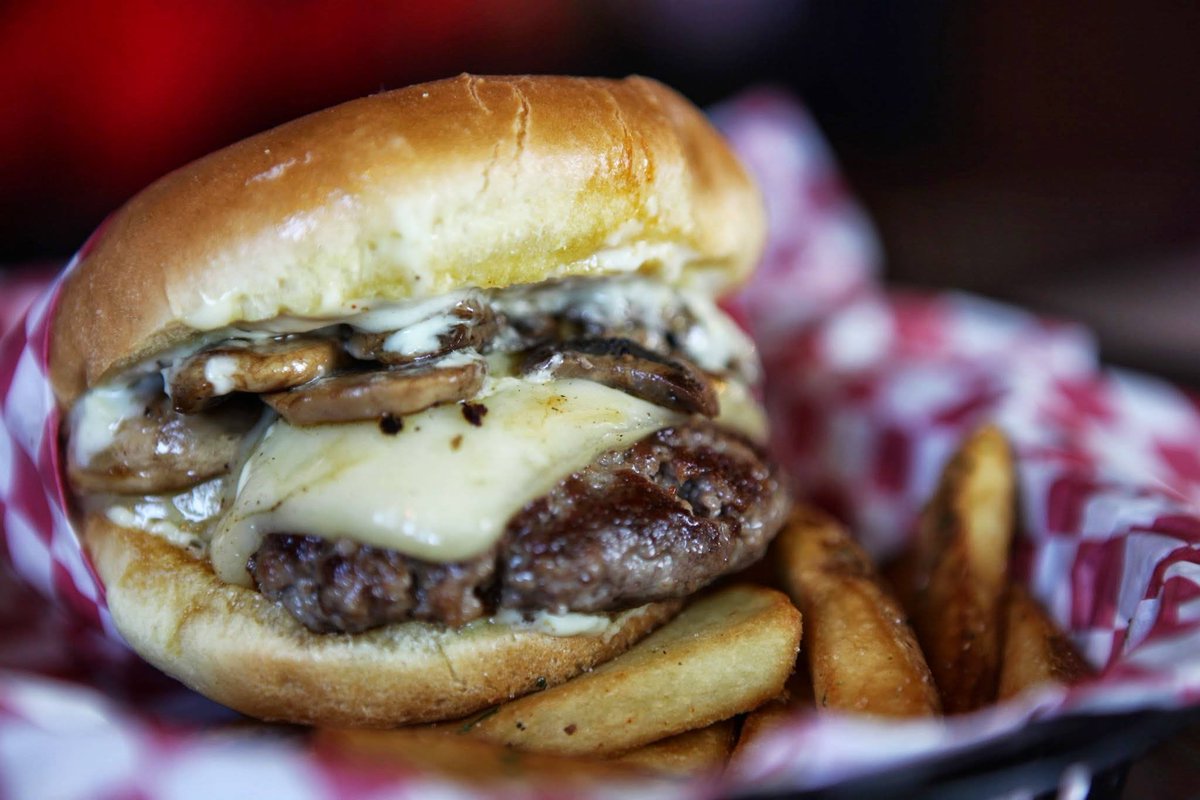 A Gargantuan Amount of Mushrooms, "Smothering" One of Our Juicy Burgers, Covered with Melted Swiss Cheese with Garlic Aioli.#seattle #yum