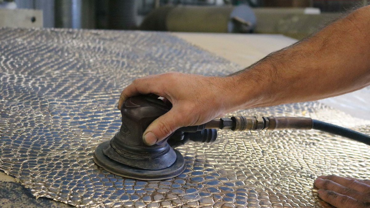 danfieldleather's tweet photo. Distressing this gorgeous two toned leather by hand. #goldfoil #distressedleather #leatherhides #madeinla https://t.co/qVzxY0m6g6