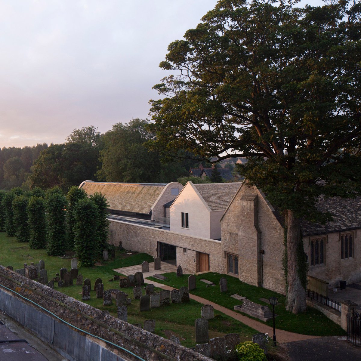 dezeen's tweet photo. Acanthus Clews Architects has renovated and extended a medieval church hall in the English Cotswolds: https://t.co/OrQCjJJj30 https://t.co/LYlWMmy7fe