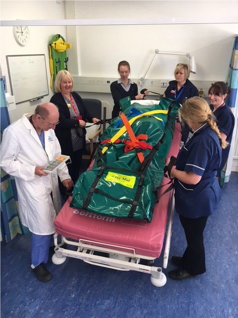 educationPHFT's tweet photo. Staff training in the Bariatric EvacMat for emergency evacuation #poolehospital @poolehospital https://t.co/f7IXyHBx1z