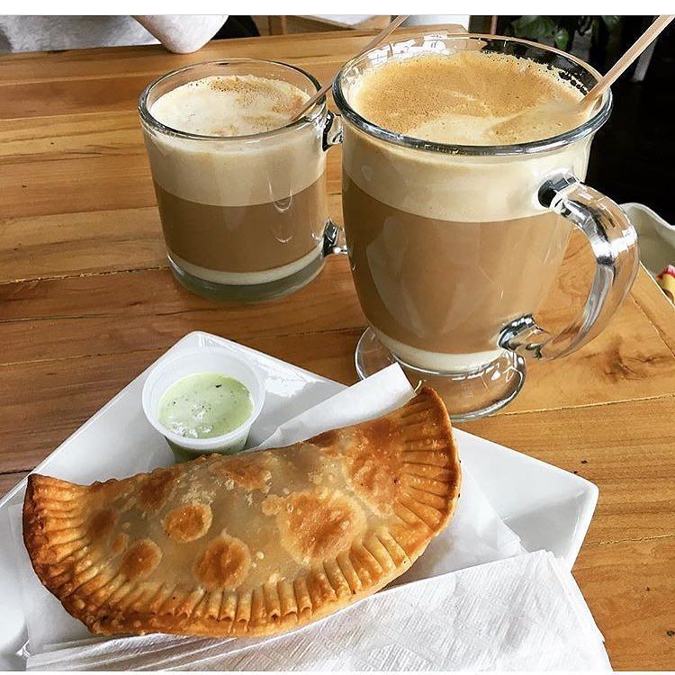 The Canary Island and a ham and cheese empanada at <a href="/bottomsupcoffee/">Bottoms Up Coffee</a> #cbuscoffee via @thecolumbusexplorer
