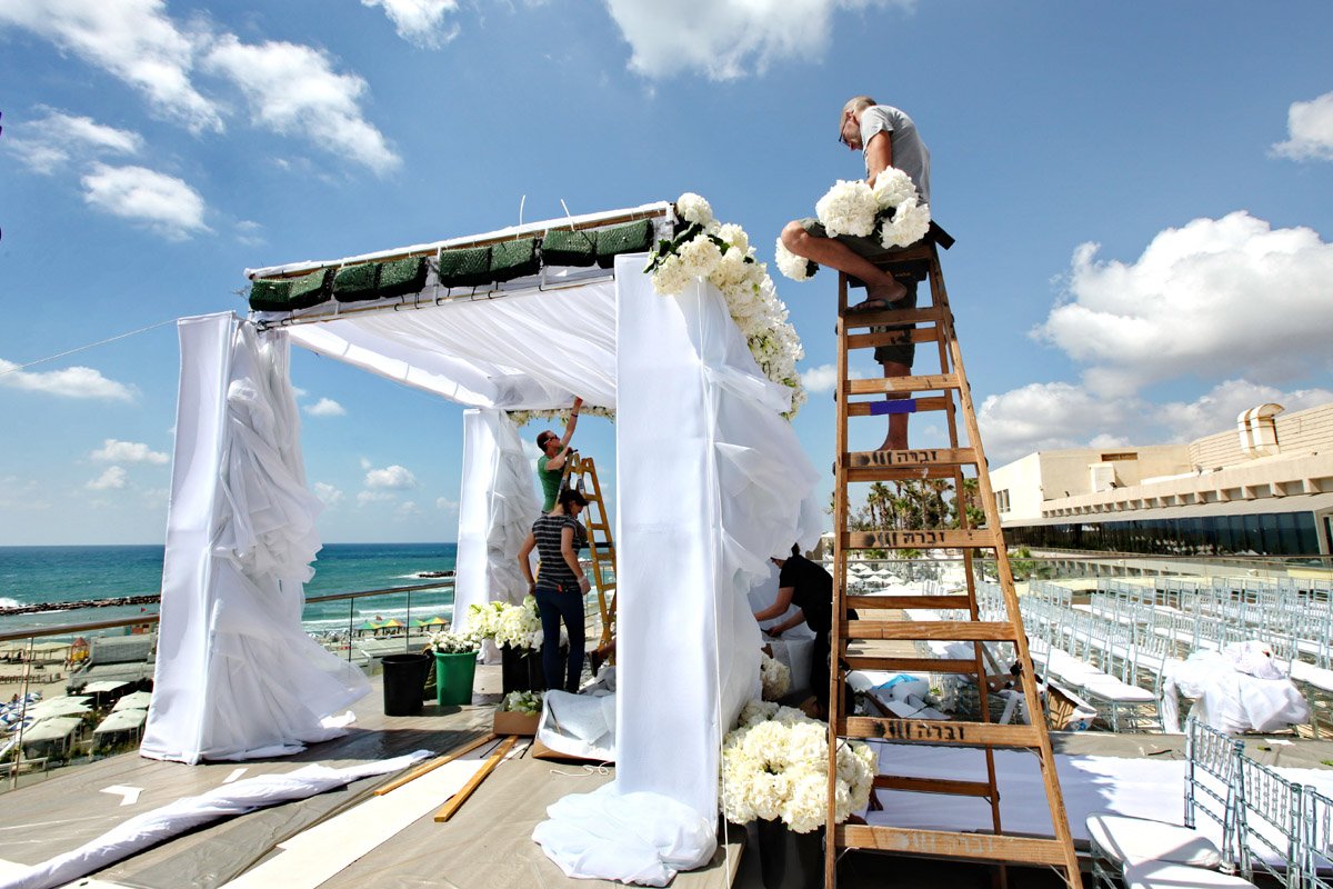 Putting together this stunning #Chuppa on the <a href="/TelAviv/">Tel Aviv</a> #beach! @israelwedding <a href="/JewishWedding/">ModernTribe Wedding</a> <a href="/SmashtheGlass/">Smash the Glass</a>