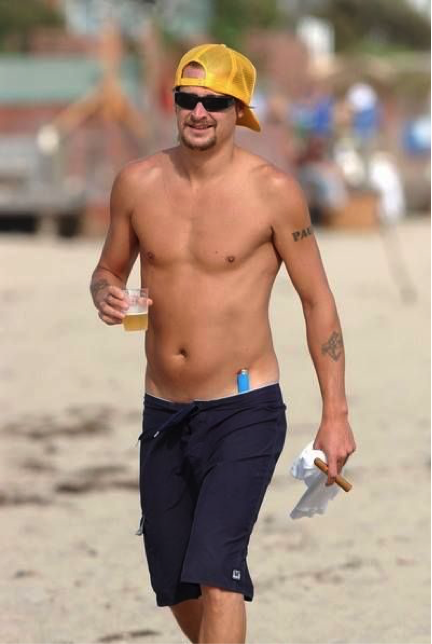 KidRock's tweet photo. Beach essentials: beer, lighter, cigar. https://t.co/WxR6BPYxYy
