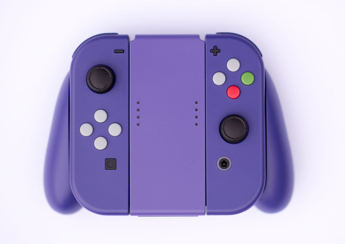 Kotaku's tweet photo. Nintendo Switch controller cosplays as GameCube pad. https://t.co/6zyrtmUoHq https://t.co/eGNZmaxo04