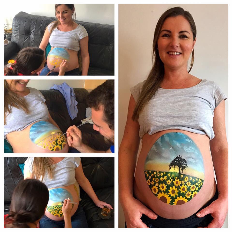 #Sunflower baby bump for my beautiful friend🌻Dad helped out too...cute! mimismunchkins.com #babyshower #BumpPainting