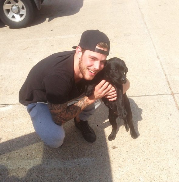 DallasStars's tweet photo. It's #NationalPuppyDay! Here's Tyler with Cash, one of his two labs. They're both good dogs. https://t.co/JgxONEtZ2F