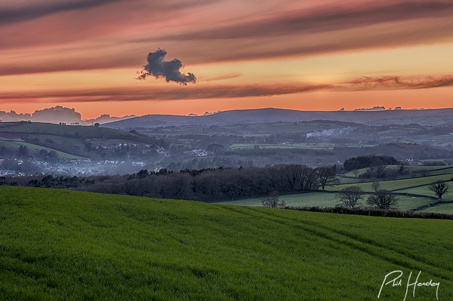 Afterglow light from the hills above #BerryPomeroy, with #Totnes in the mists below and #Dartmoor beyond