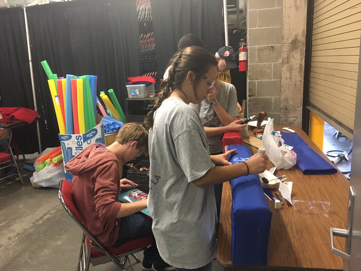 Our creative artists doing some last minute painting of the bumpers.