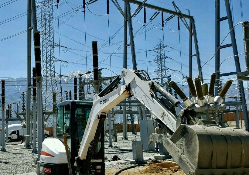 Our #miniexcavator doing some SCE #substation work- what a backdrop! #jobsite #bobcat #heavyequipment