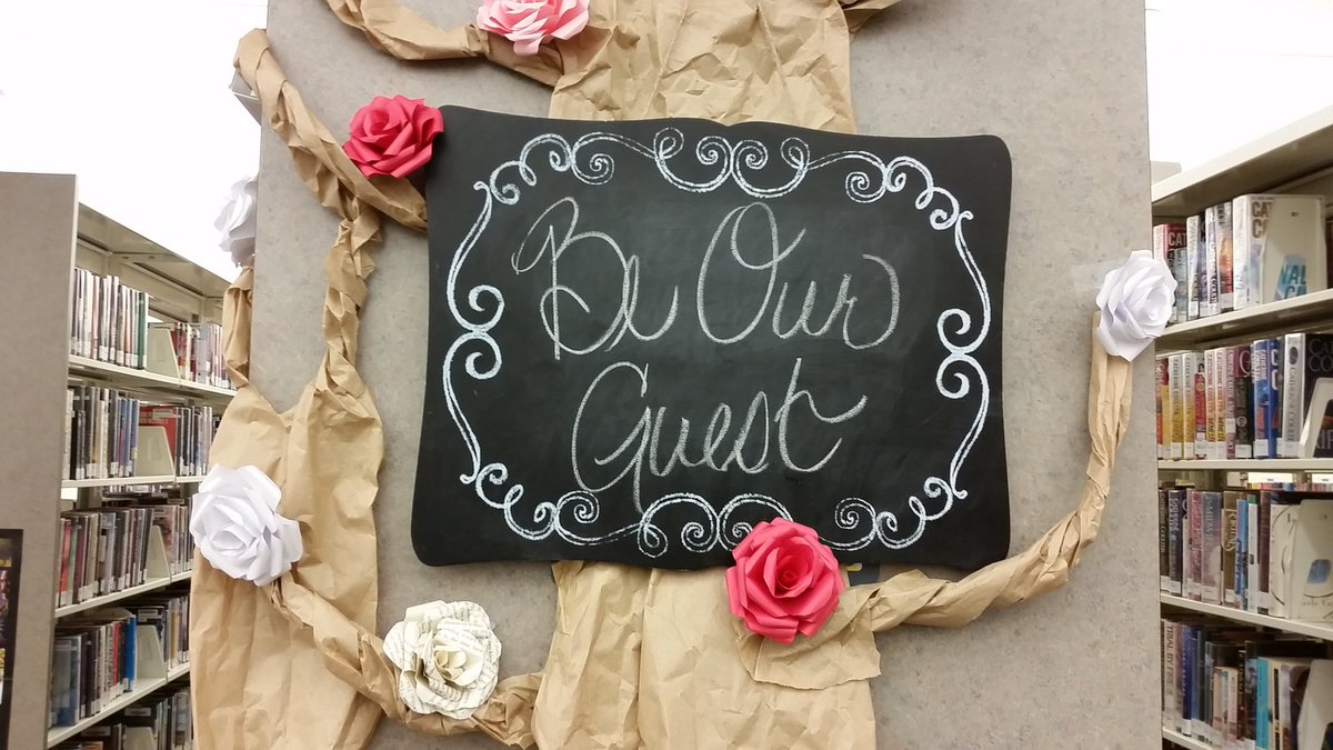 LibraryBlonde13's tweet image. My new library display with the beautiful paper roses I made!!! 🌹💖📚 #BeautyAndTheBeast #LibraryLife #LoveMyJob
