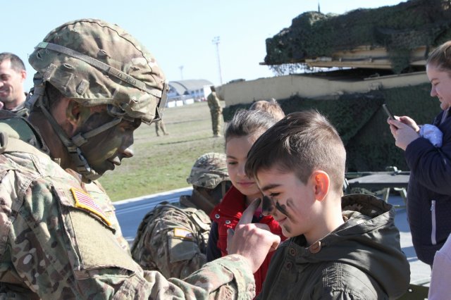 USArmyEURAF's tweet photo. #FridayFunDay: Soldiers show off their vehicles & equipment during Romanian Kids Day https://t.co/zztyNpcUKc #DynamicPresence #StrongEurope https://t.co/PXtNC4LOWW