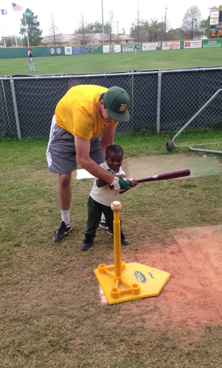 delgadodolphins's tweet photo. Delgado infielder Will Sheats helps a young fan with his swing during a prep game at Kirsch-Rooney Stadium on Friday. #community https://t.co/mhrI7wGrJQ