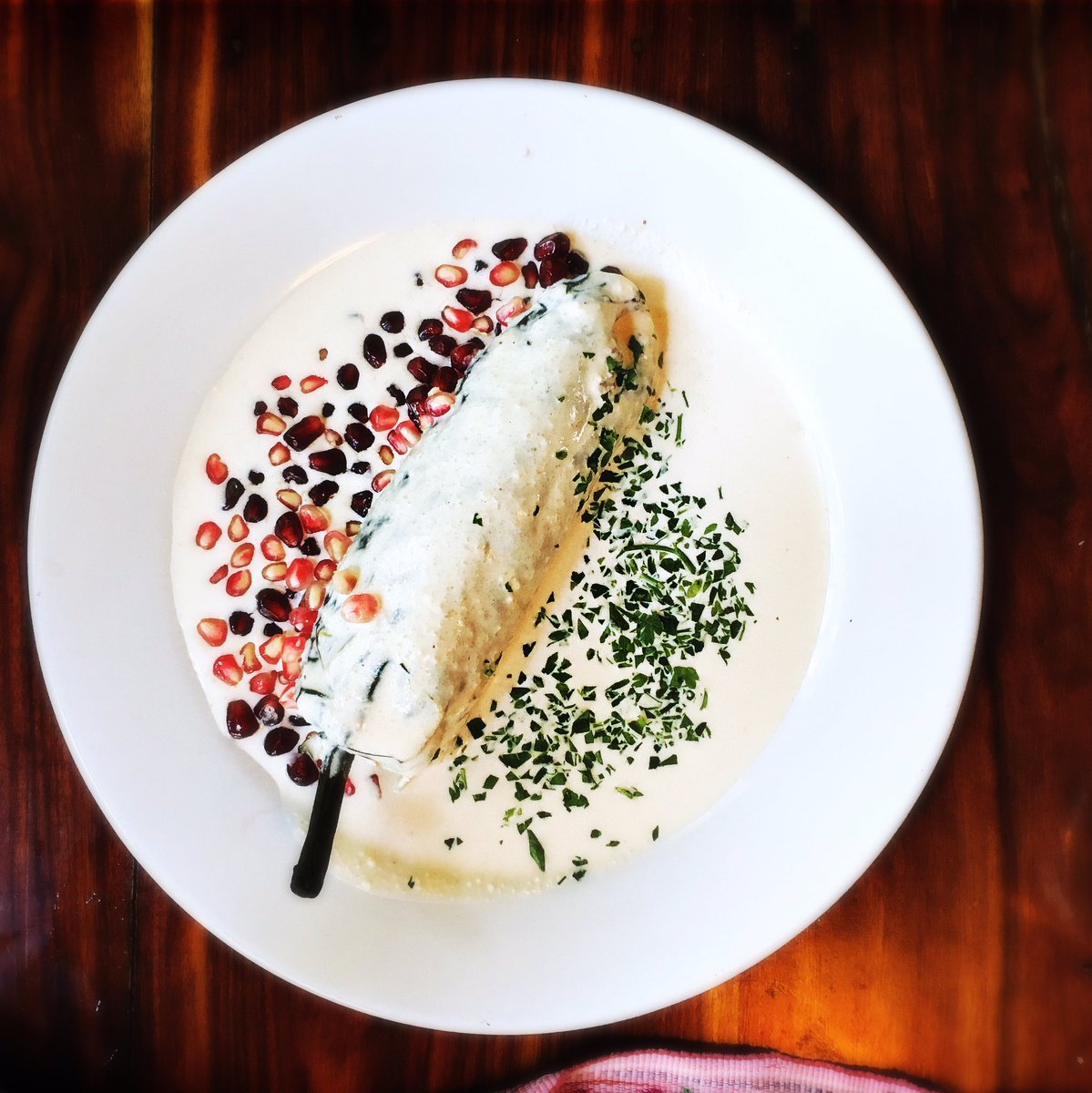 #Cetli's signature, Chile en nogada: spiced & fruity meat-stuffed poblano w/ walnut, cheese & sherry liquor sauce.