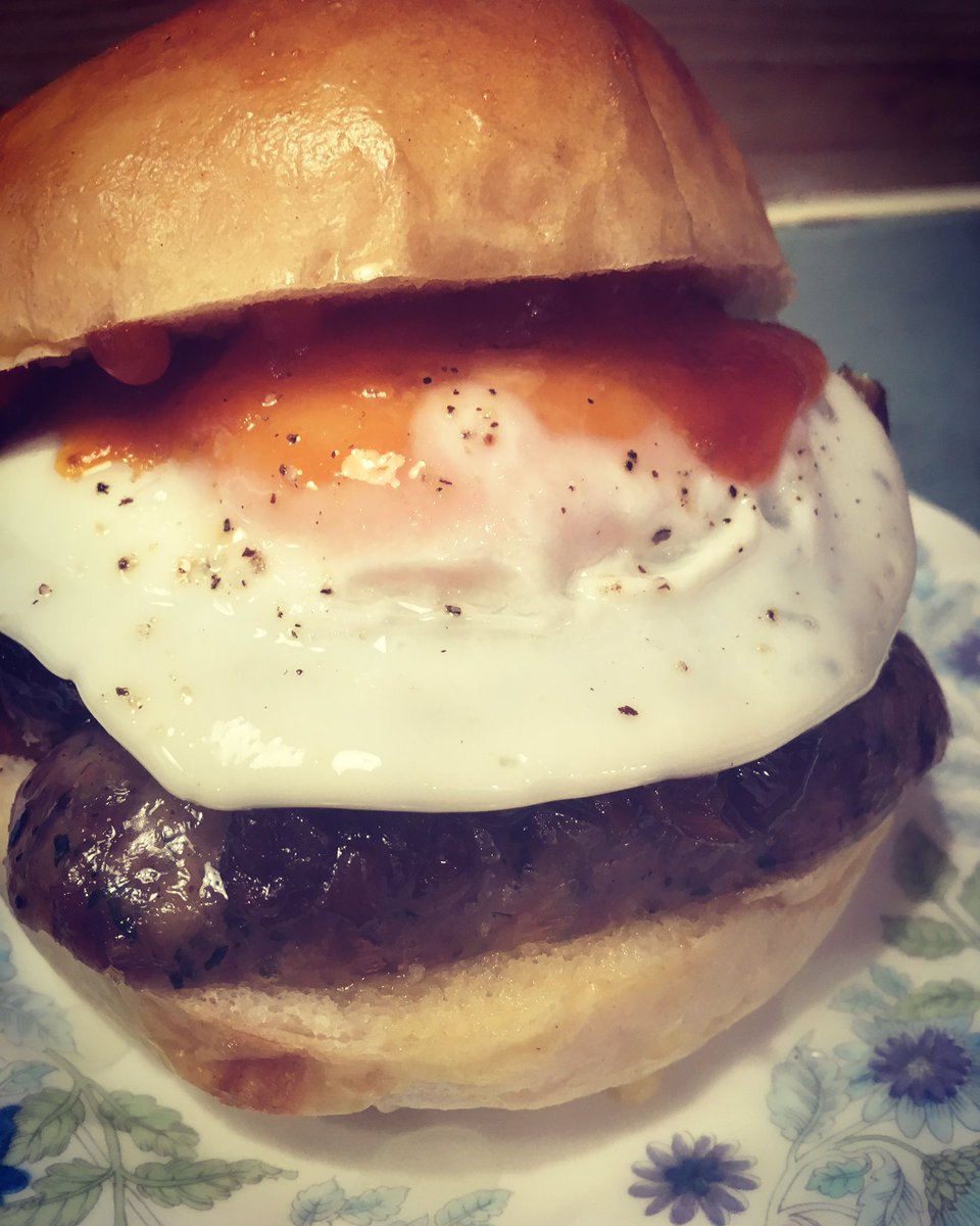Delicious Cumberland sausages from <a href="/millroadbutcher/">MILL ROAD BUTCHERS</a> , fried egg, caramelised red onions &amp; homemade ketchup in a @dovecotebakery brioche bun