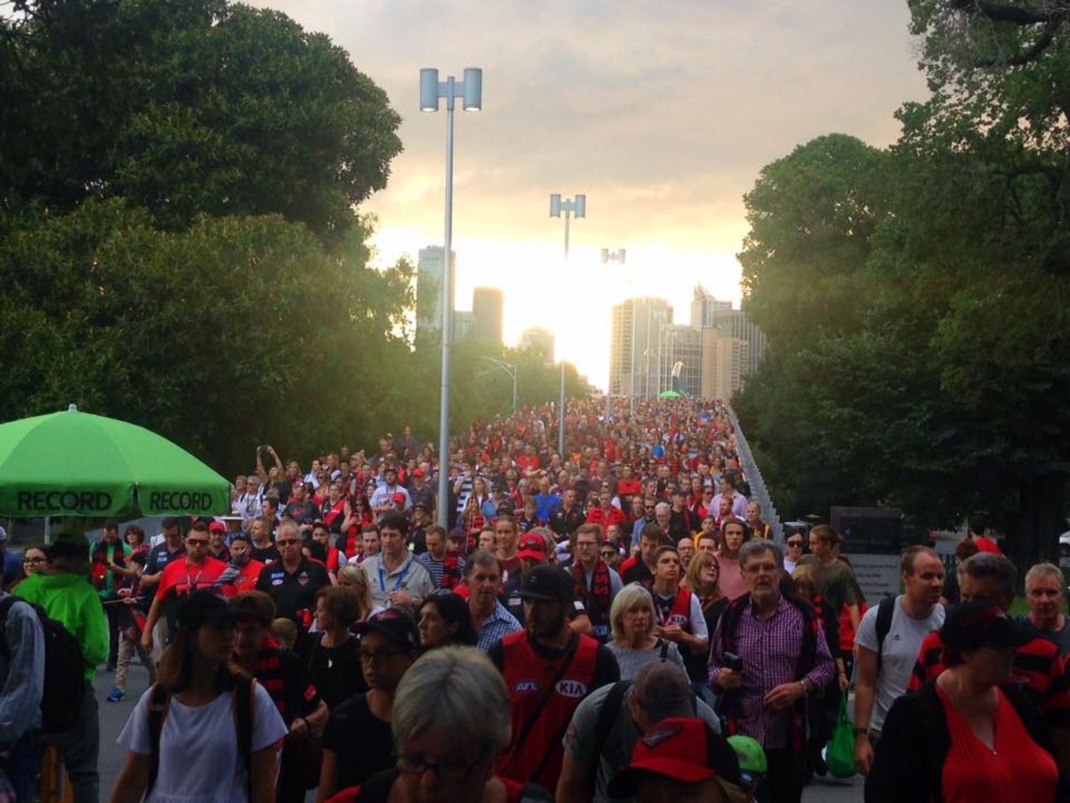 Reidy_777's tweet photo. A sea of red &amp; black even the sun was behind us. ⚫️🔴 #ComebackMarch #Essendon https://t.co/lOvIKSXbJ9