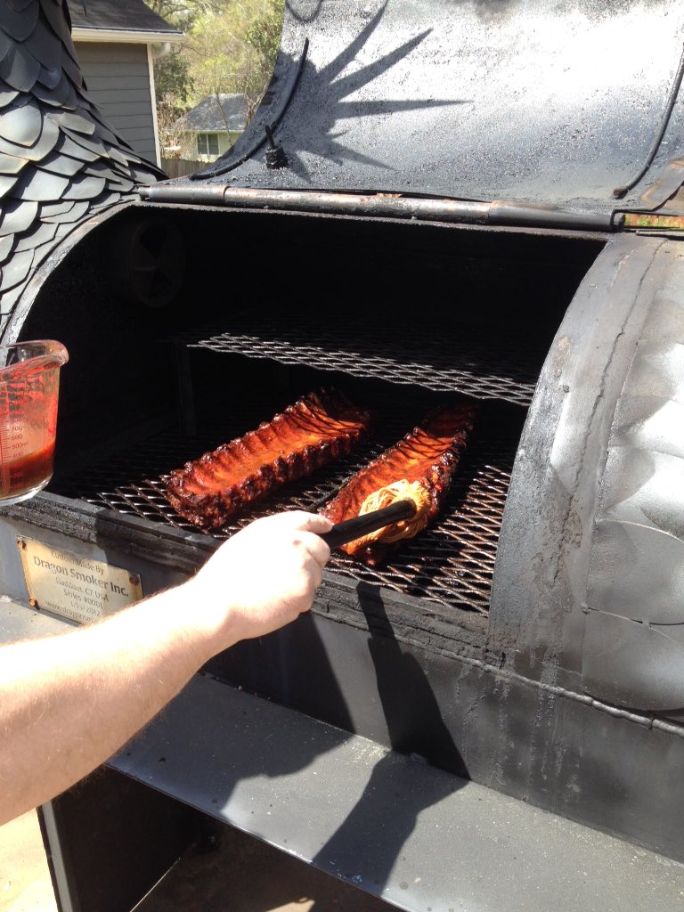 2 hours in and it's time to mop the ribs #bbq #bbqlife #BMRTG #dragonsmokerbbq