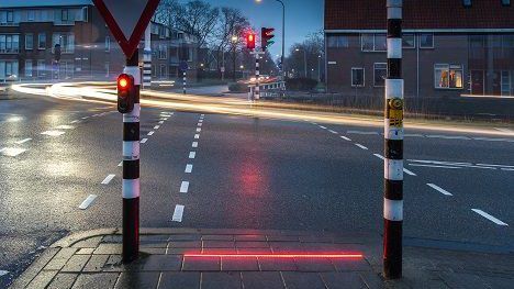 cduhigg's tweet image. People won’t stop staring at their phones, so a Dutch town put traffic lights on the ground dlvr.it/Nk2sF4