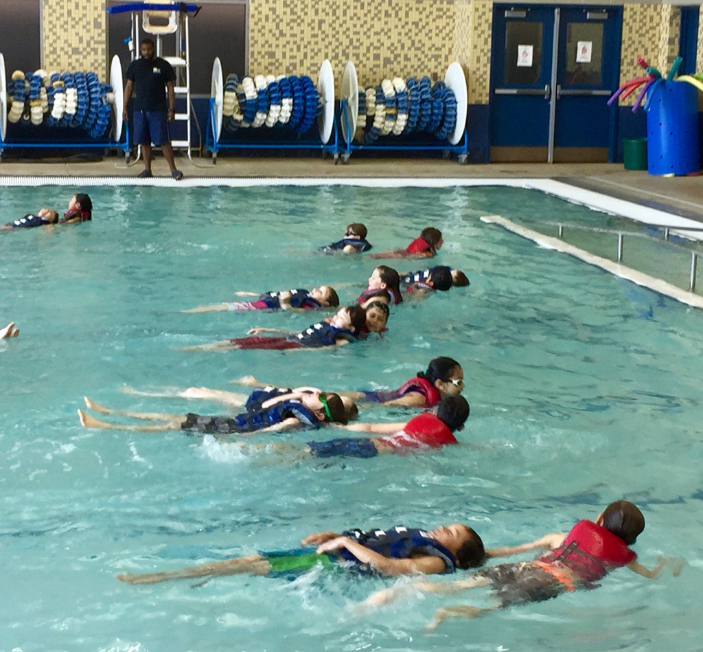 McK third graders practicing safety skills on the last day of swimming.