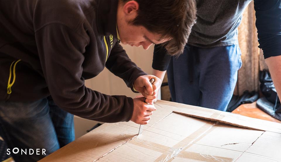 CITSonder's tweet photo. A Multimedia student and a cardboard box? Well this is team Collú creating their prototype for their project! https://t.co/HE4FreZrWX