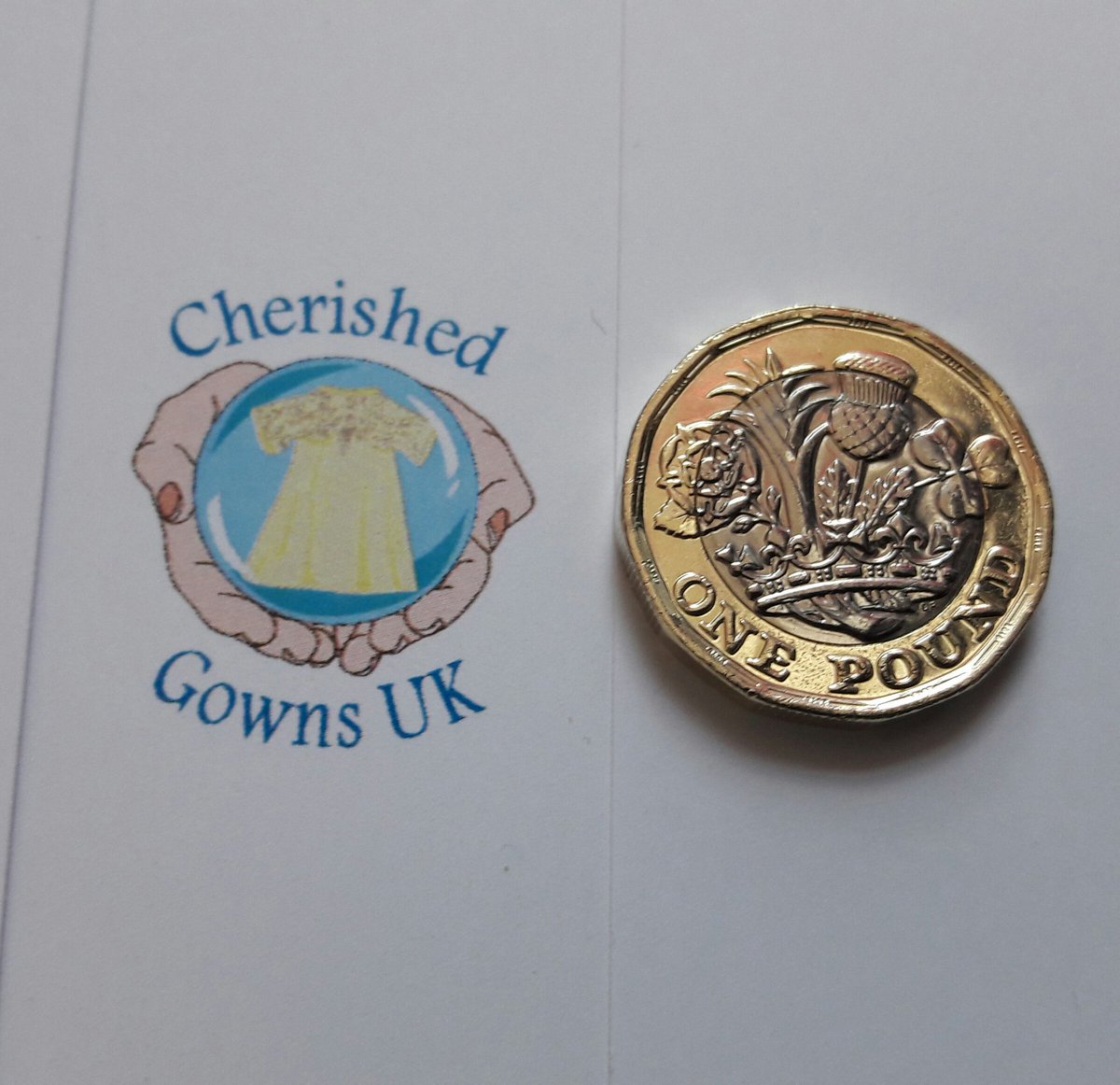 Donating our first new pound to @cherishedgowns  as they are now a charity! #newpoundcoin #payitforward #charity #wrappedinlove