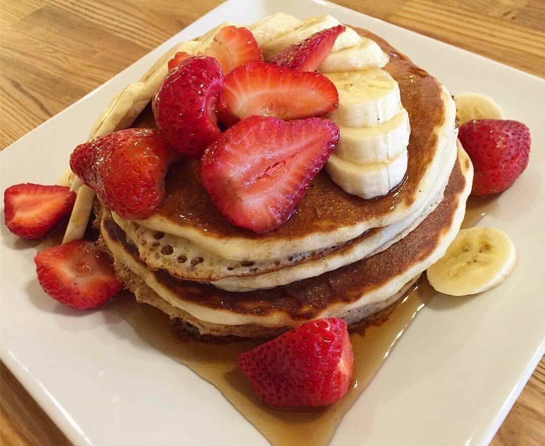 #Buttermilk #HotCakes! Topped with fresh #strawberries and #bananas! It's what's for #breakfast! Served 'til 3pm!