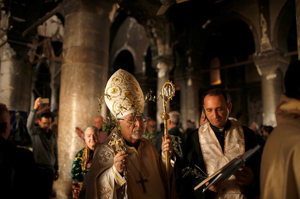 RaveenOjmaya's tweet photo. Christians attend the first #PalmSunday in Qaraqosh church, #Nineveh since #Iraqi forces retook it from #ISIS. https://t.co/EurFR008Qf