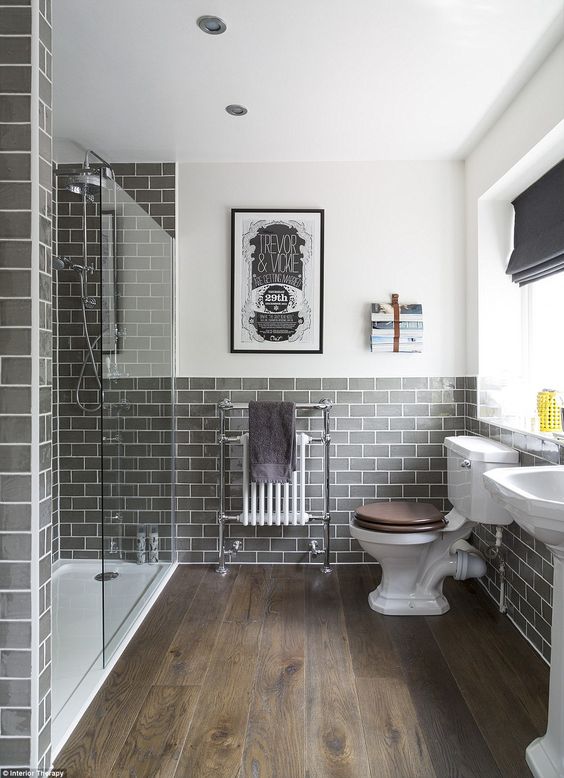 #HowTo Grey No.4: Graphite grey tiles and cream walls will update any standard white porcelain bathroom suite. #Interiordesign #bathroomidea