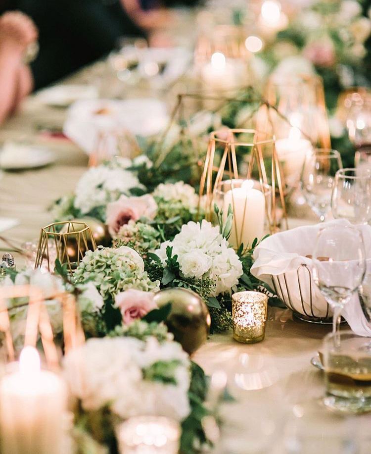 Adorned with greenery and candle arrangement, this set is truly magical! Credit: koncept.events. #bridestory