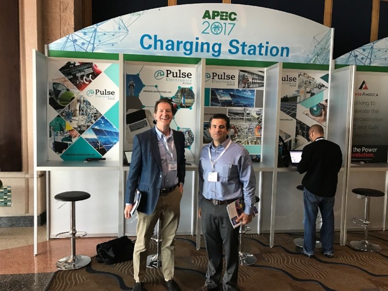 PulseElecYageo's tweet photo. We're charged up at APEC 2017 in Tampa this week! Mark & Ryan at the #PulseElectronics Charging Stations. #apec #pulsepower https://t.co/PEZ3O4w7rH