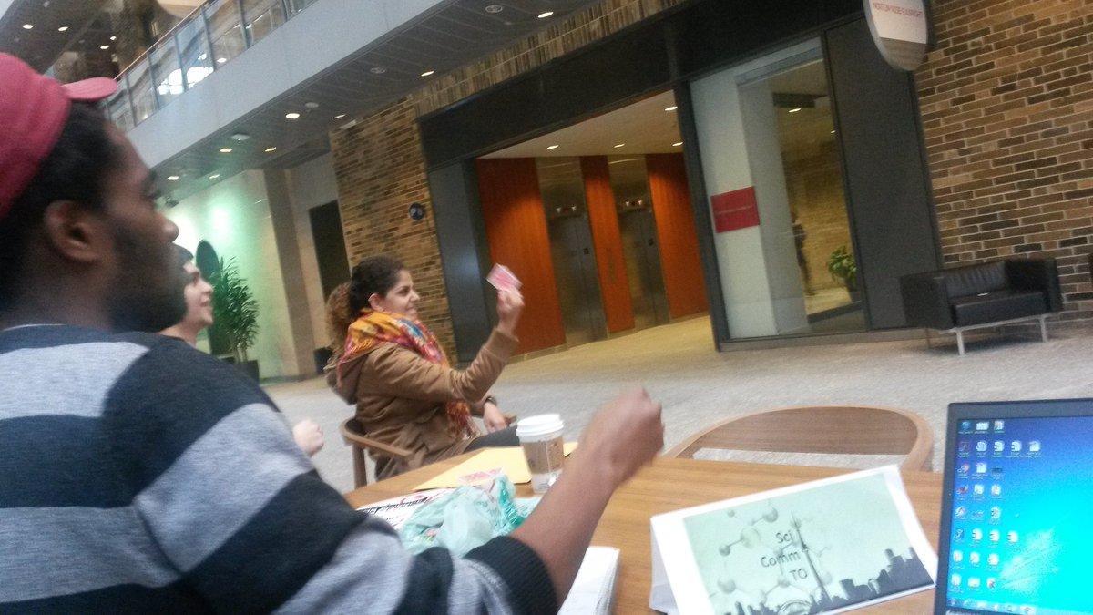 SciCommTO's tweet photo. When a #SciCommTO meeting deteriorates into @whereisscience teaching us how to throw cards to kill. https://t.co/bcQB4rZSJV