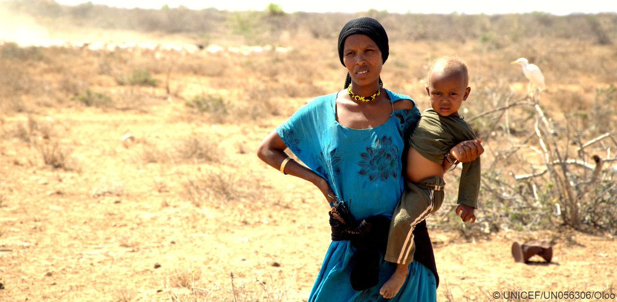 UNICEF's tweet photo. In a drought-stricken village in #Kenya, a mother carries her child. We’re delivering lifesaving support to communities and families. https://t.co/dPcvWvVAvP