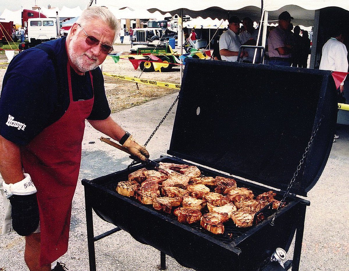 Iowa80Truckstop's tweet photo. Beloved Bill Peel is cooking the chops to perfection in 2003. Only 15 Weeks until the Jamboree! #wtj2017 #iowa80 #tbt #iowachops https://t.co/dX54ELvpbD