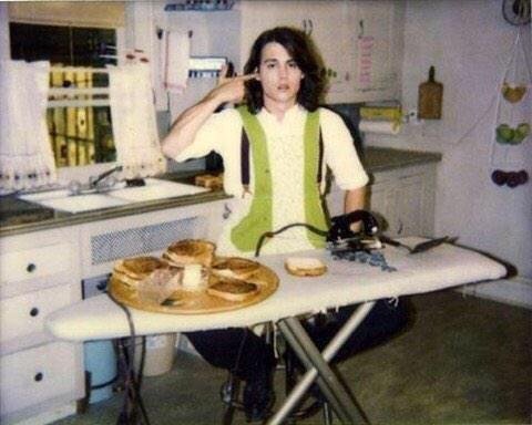 NME's tweet photo. #ThrowbackOfTheDay: Johnny Depp making a cheese toastie with an iron... 1993 https://t.co/GsPwLzI4Jw