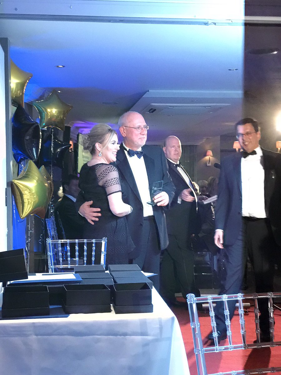 Andrew Castillo accept an award on behalf of opthalmology #LincsEdCelebration