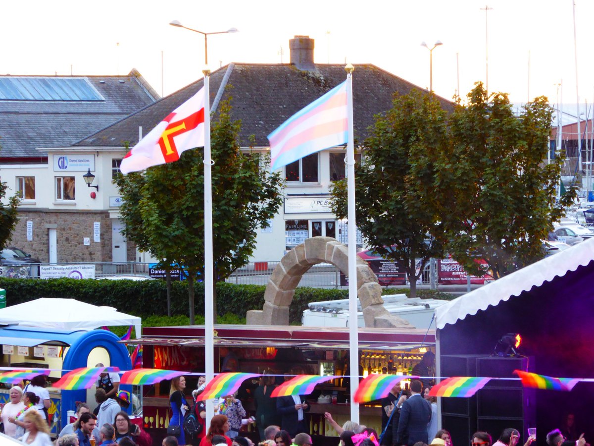 TransJersey's tweet photo. The trans flag and the Guernsey flag flying high over @liberatecipride in 2016 #tdov @LiberateHQ @LiberateJersey https://t.co/MlV46ZRPSV