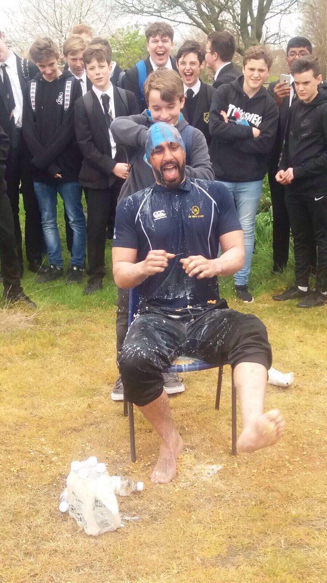 MeridianPE's tweet photo. Bottle flip challenge was a great success to raise money for SHINE today! Some say Mr Choudhury still smells of milk!! #SwimmingCapGirl https://t.co/m9x9kRIHiu