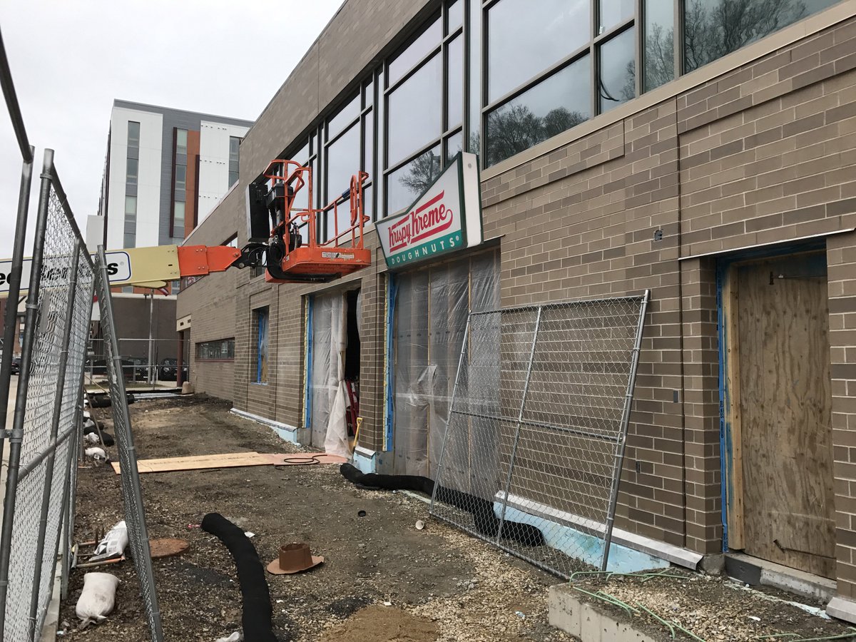 UWMadisonPolice's tweet photo. It's official and the signs are going up! We couldn't be more excited to announce that our new building will have a @krispykreme drive thru! https://t.co/lvybtm0lHK