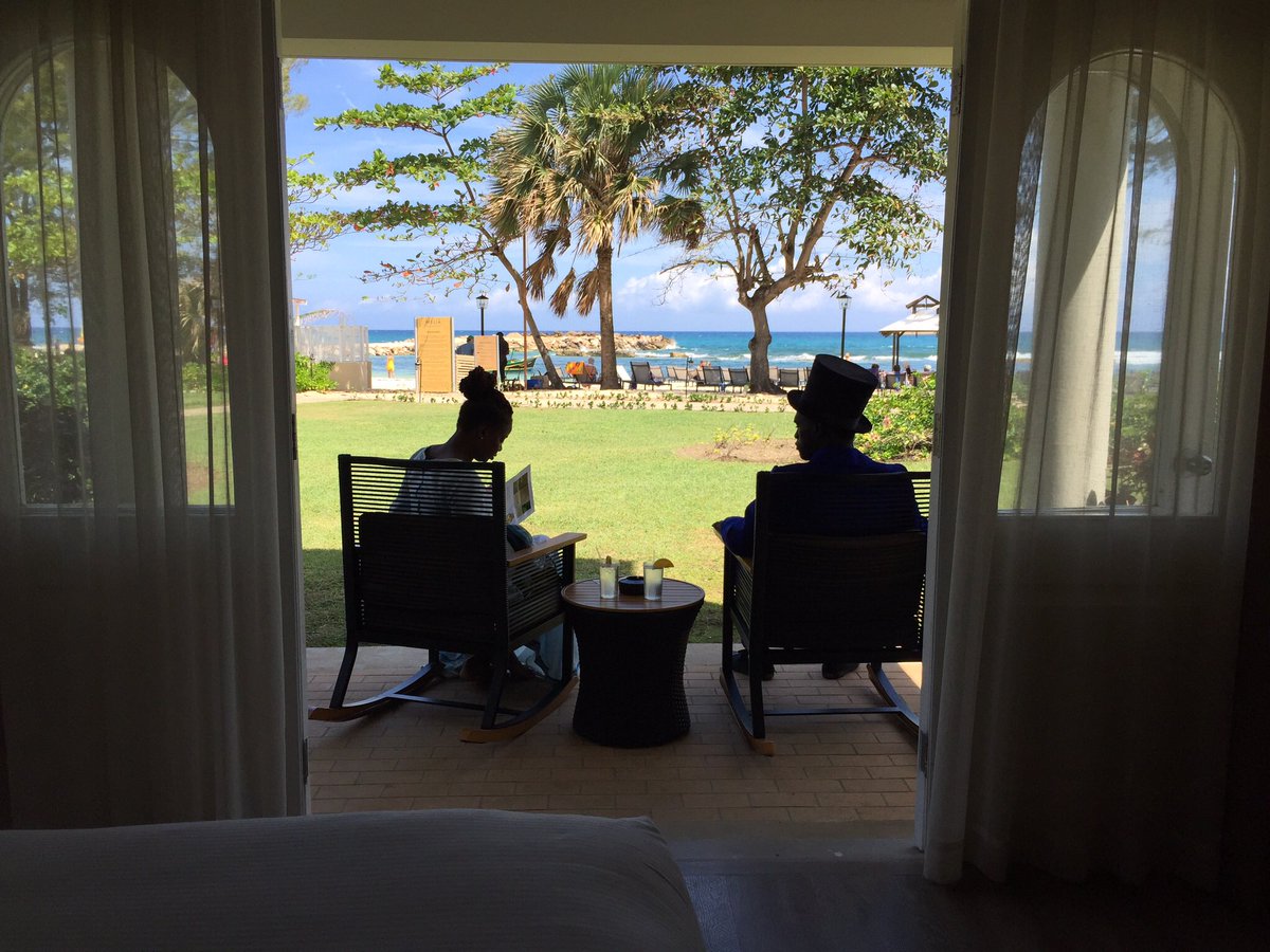 A couple of guests from yesteryear on the patio of an ocean-view room @meliabraco #colonialvillage #resort #Jamaica