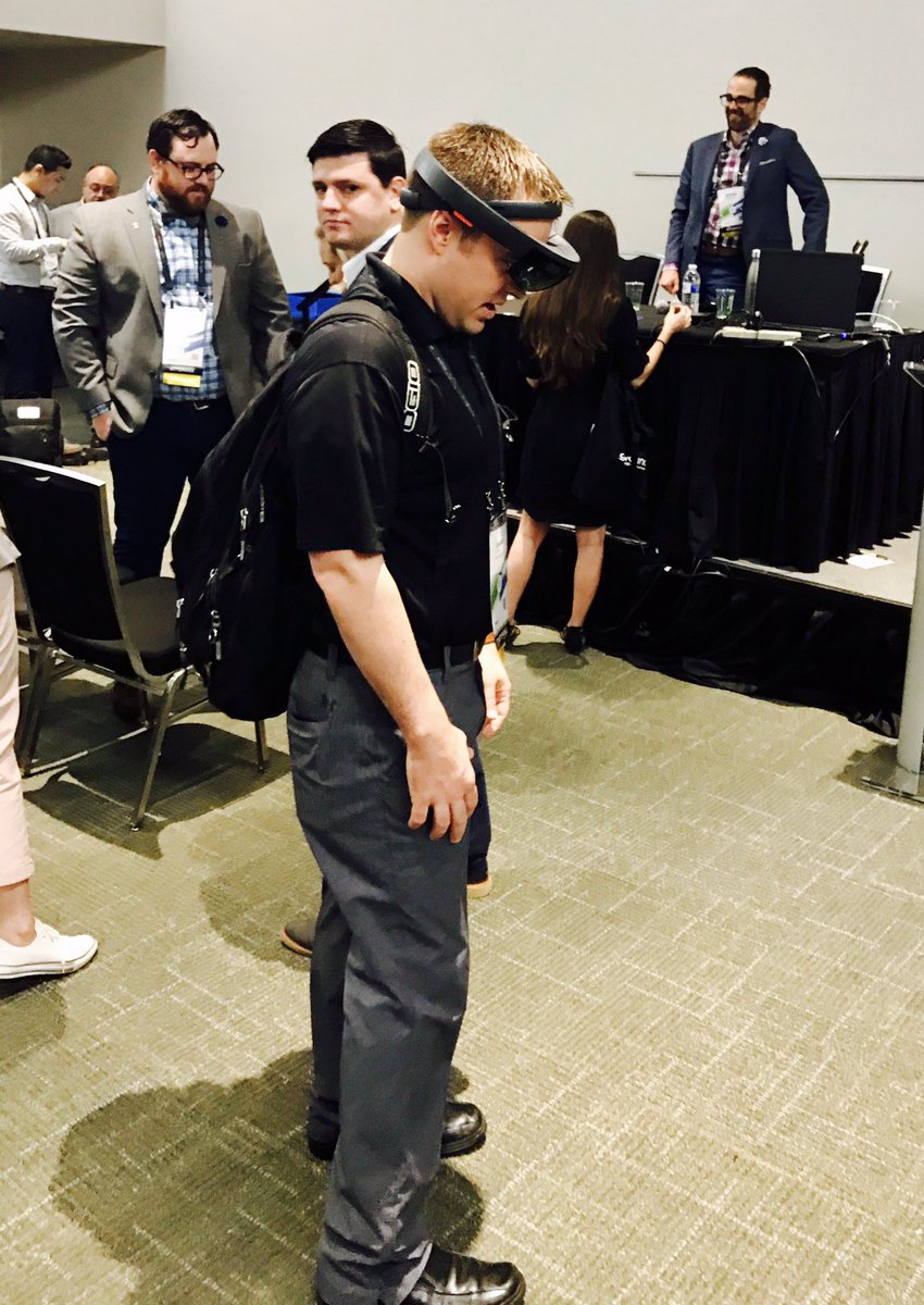DisruptAEC's tweet photo. @taylor_cupp checking out X-ray vision into concrete slab via @HoloLens @procoretech #GBK17 legends @nathancwood @gieza0527 in background https://t.co/nrJ0Gf3YPO