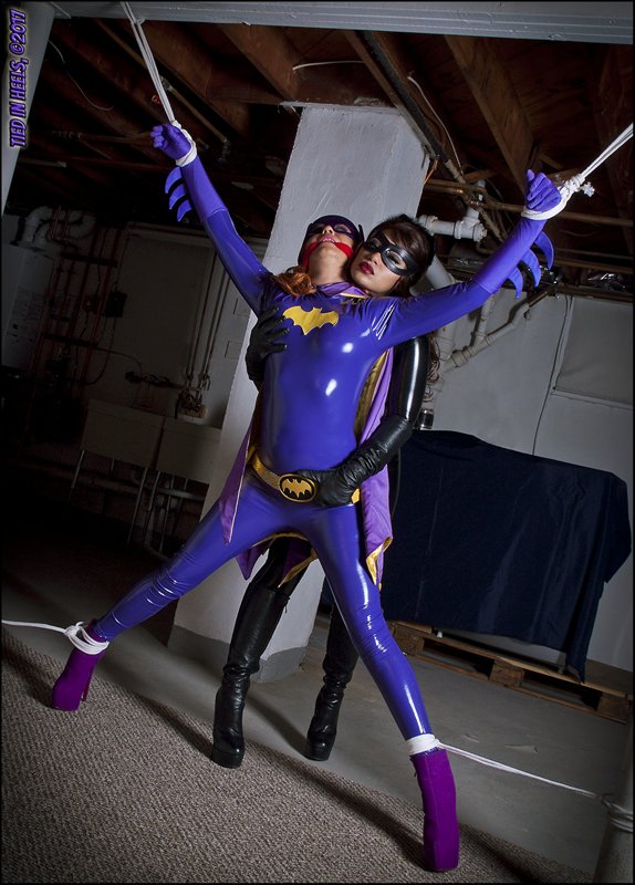 Batgirl is helpless in the evil clutches of Catwoman! http. 