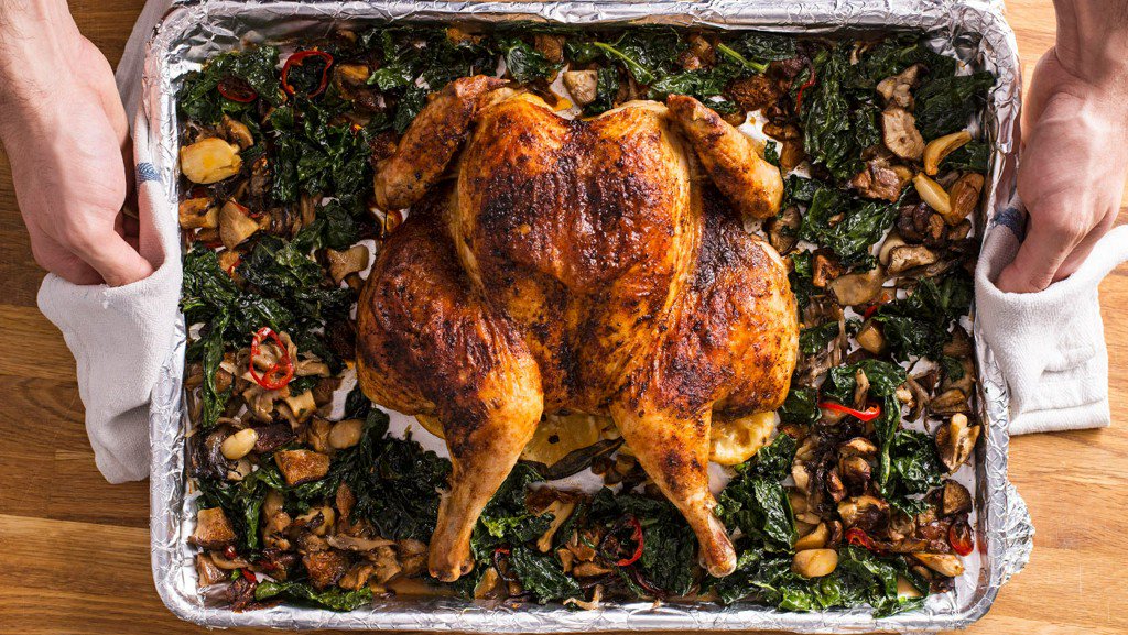 TastingTable's tweet photo. A spatchcocked chicken with lemony mushrooms and kale is the perfect sheet tray meal https://t.co/Z25Hl4zR8E https://t.co/9CzOHvVSg1